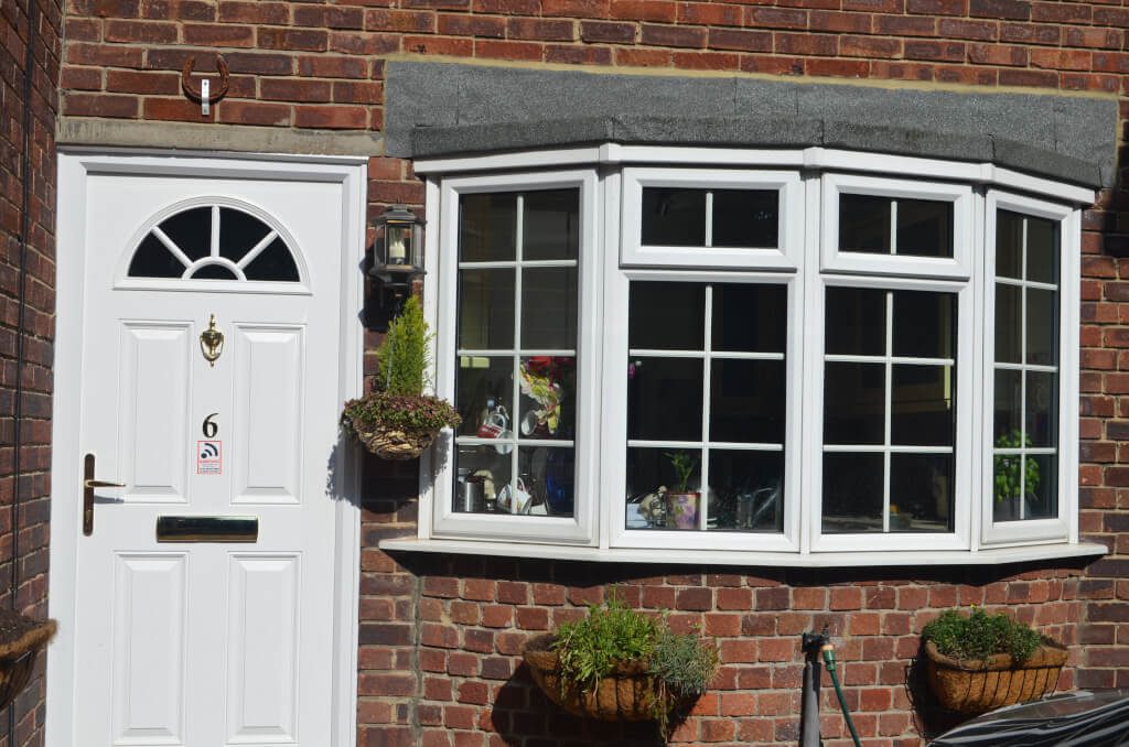 Slimline windows and composite door in white