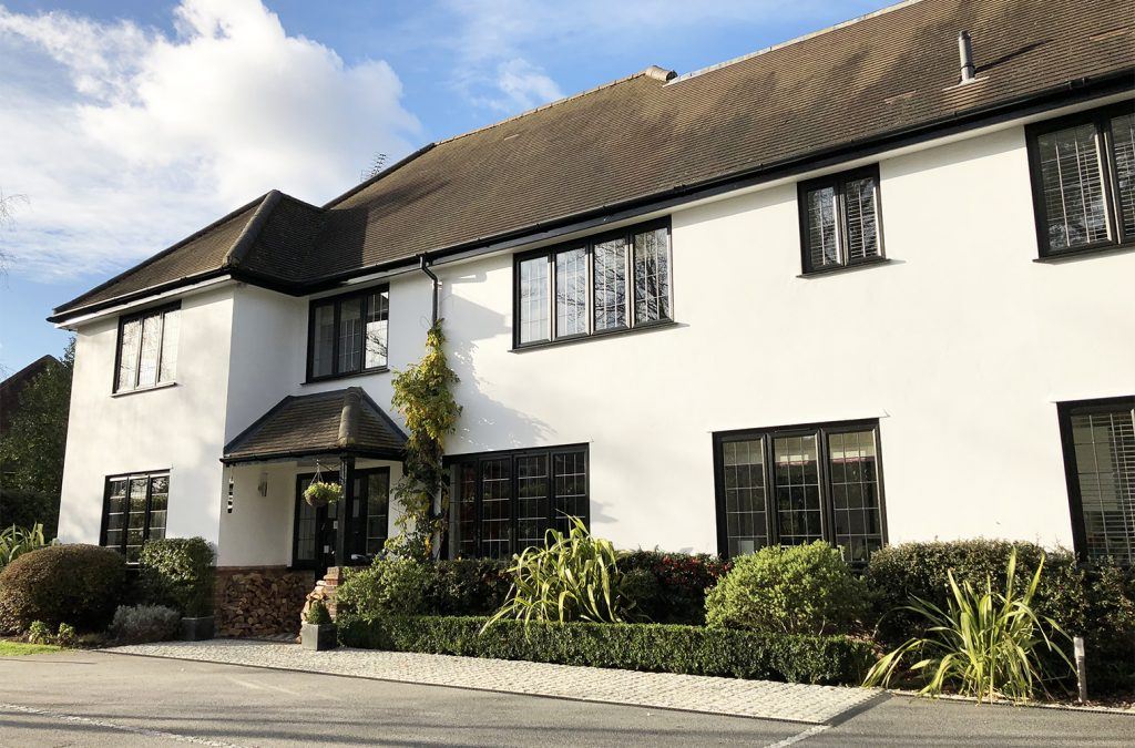 black slimline windows on white house