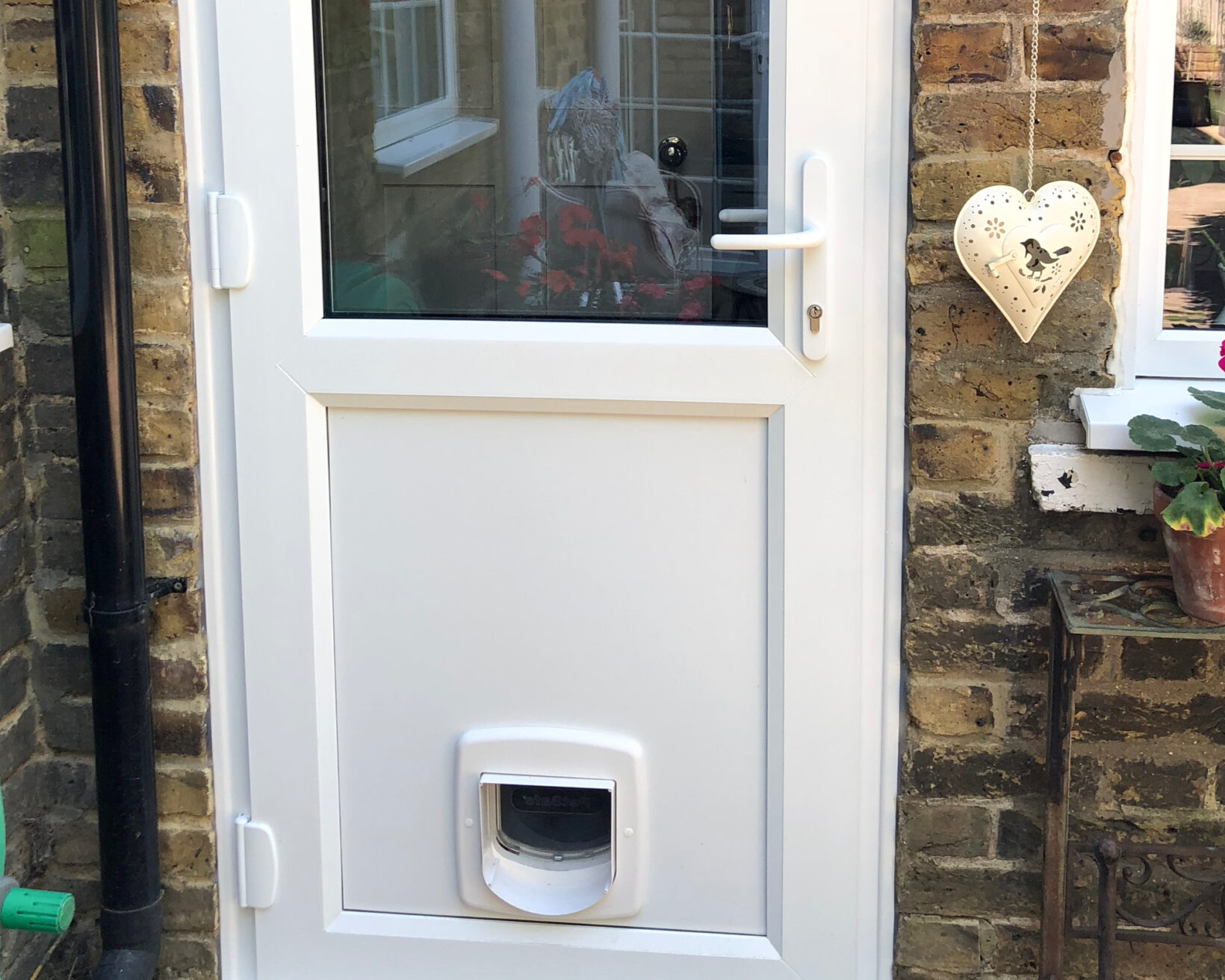 Bespoke glass partitions & cat flap installation, Surrey
