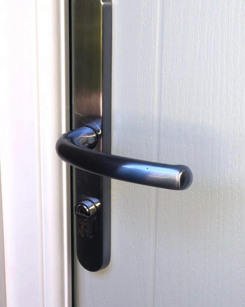 close up of door handle yale lock