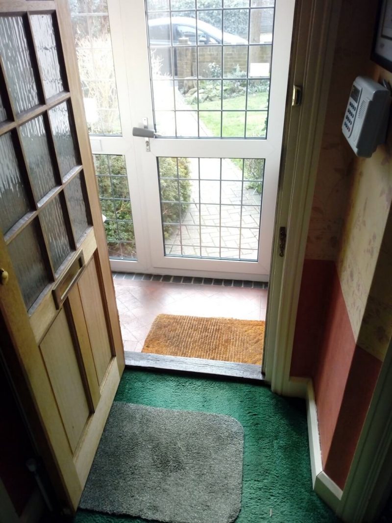 porch and old wooden door before new installation