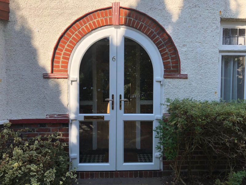 white upvc arched door byfleet