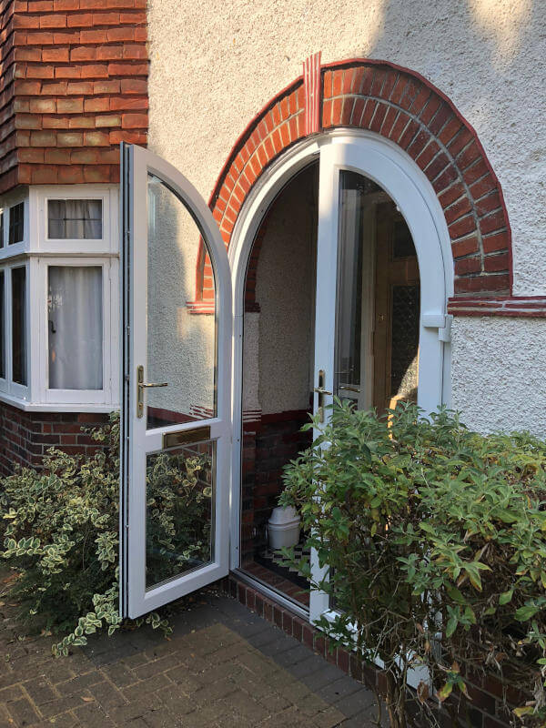 white upvc arched door open byfleet