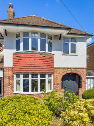 House with Slimline uPVC modern windows including Bay Windows in White with composite front door Sheerwater Glass