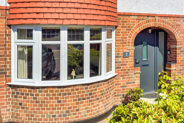 Curved window on red brick home